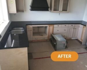 Completed kitchen with black quartz countertops cut to fit their existing light kitchen in victoria bc.